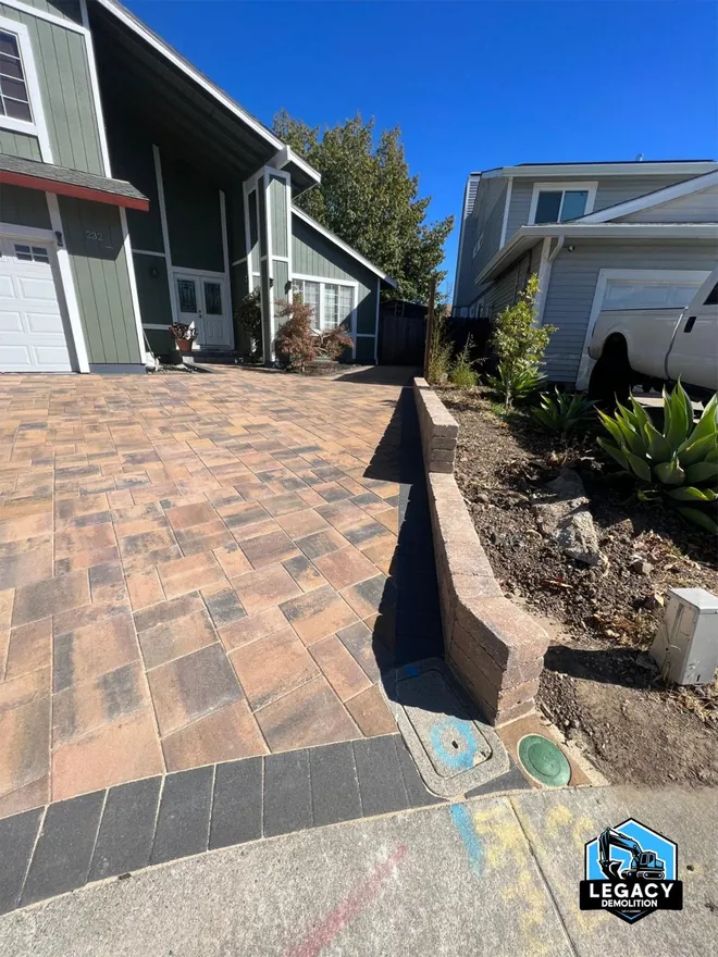 Paver driveway sectioned and lifted during removal